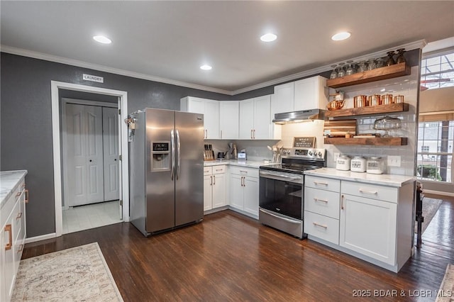 kitchen with stainless steel appliances, white cabinets, light countertops, and under cabinet range hood