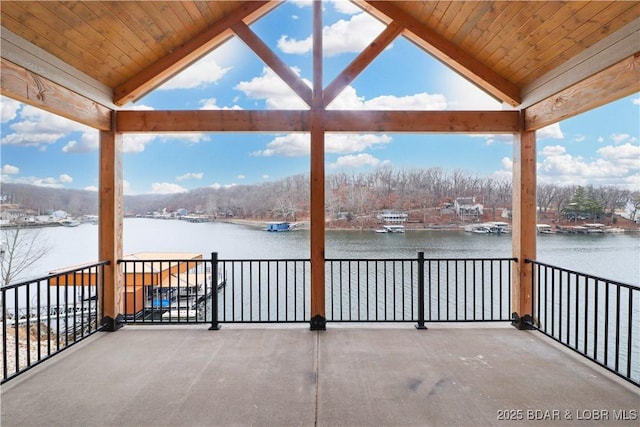 view of patio / terrace featuring a balcony and a water view