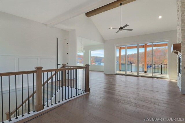 unfurnished room with beam ceiling, ceiling fan with notable chandelier, high vaulted ceiling, and dark hardwood / wood-style floors