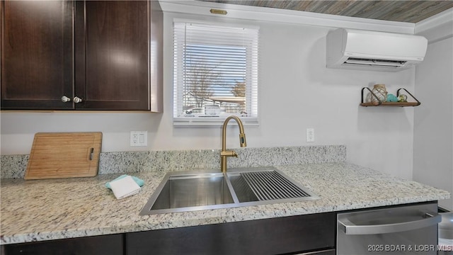 kitchen featuring sink, dark brown cabinetry, a wall mounted air conditioner, light stone countertops, and stainless steel dishwasher