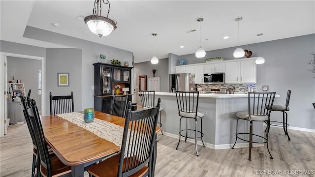 dining area featuring light hardwood / wood-style flooring