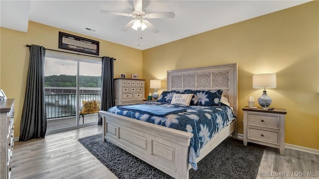 bedroom with ceiling fan, light hardwood / wood-style floors, and access to outside