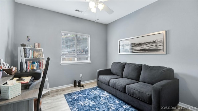 interior space with ceiling fan and light hardwood / wood-style flooring