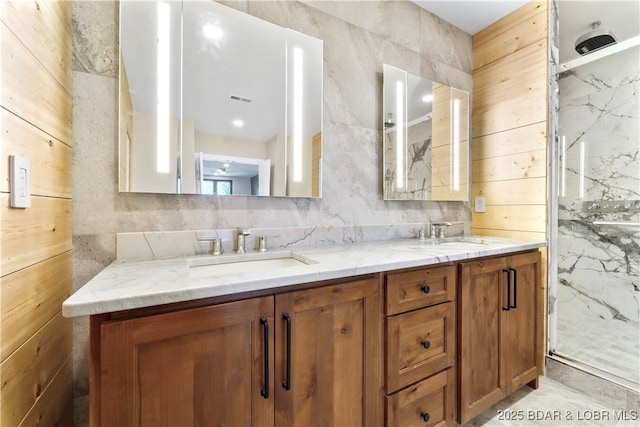 bathroom with vanity, decorative backsplash, and walk in shower