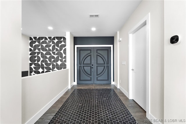 doorway to outside with dark hardwood / wood-style flooring