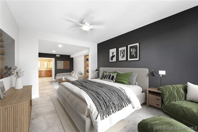 bedroom with connected bathroom and ceiling fan