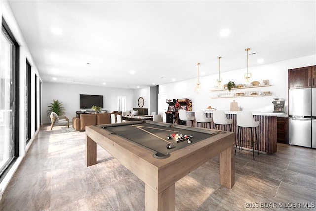 recreation room featuring bar and billiards