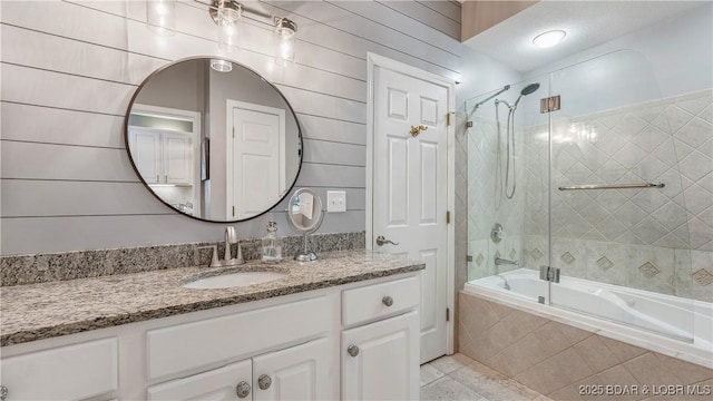 bathroom with vanity, tile patterned floors, and shower / bath combination with glass door