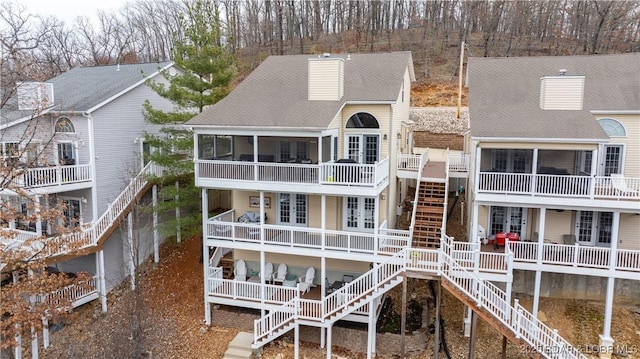 back of property featuring a sunroom