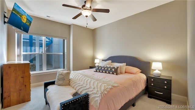 bedroom with light carpet and ceiling fan