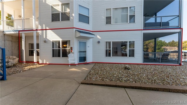 back of property with a balcony