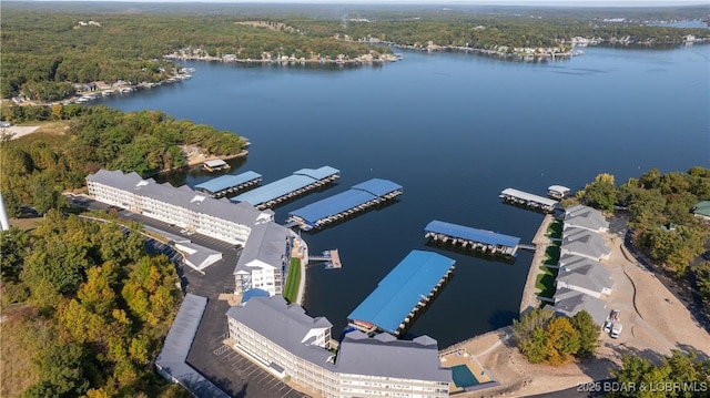 birds eye view of property with a water view