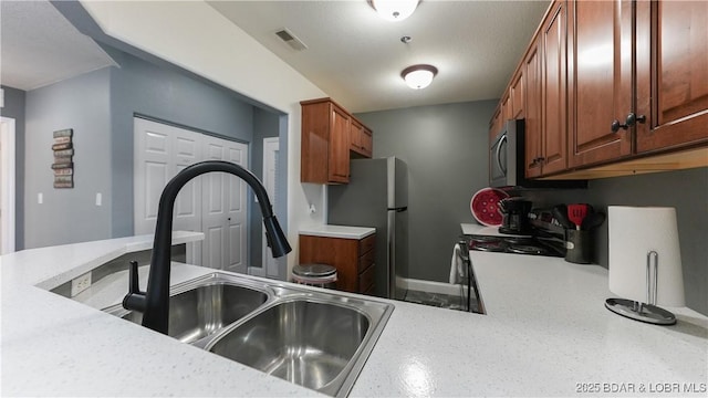 kitchen with sink and stainless steel appliances