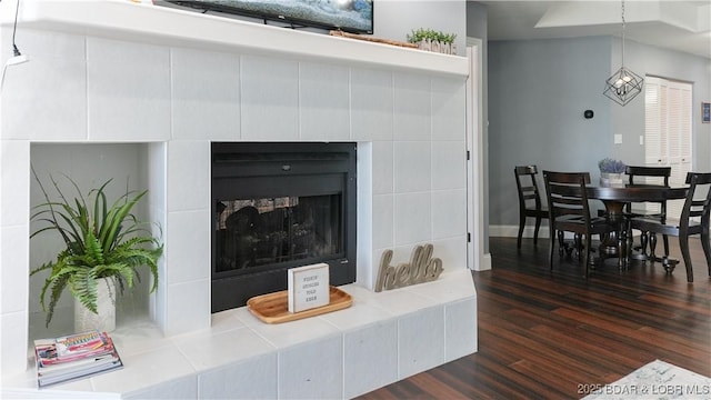 living room featuring a fireplace and dark hardwood / wood-style flooring