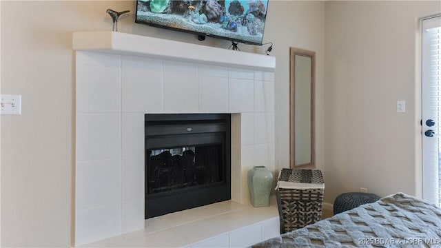 room details featuring a tiled fireplace