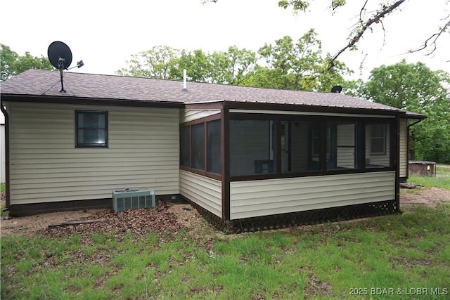747 Paulson Dr, Edwards, MO 65326 - back of house with a sunroom and central AC