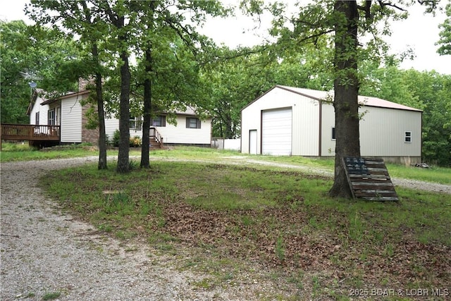747 Paulson Dr, Edwards, MO 65326 - view of yard with an outbuilding and a garage