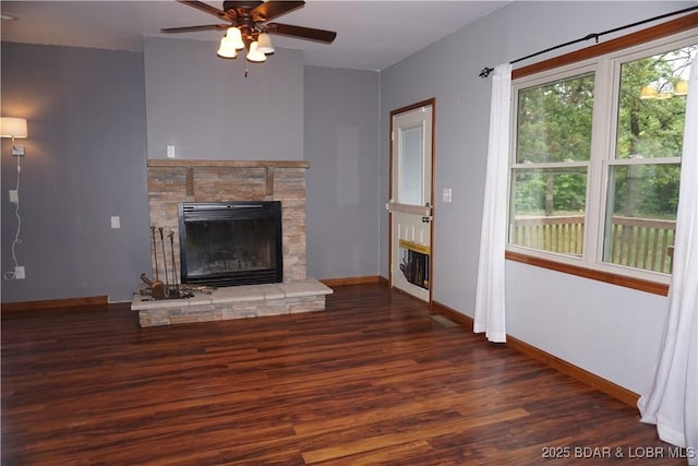 747 Paulson Dr, Edwards, MO 65326 - unfurnished living room with dark wood-type flooring, a fireplace, and ceiling fan
