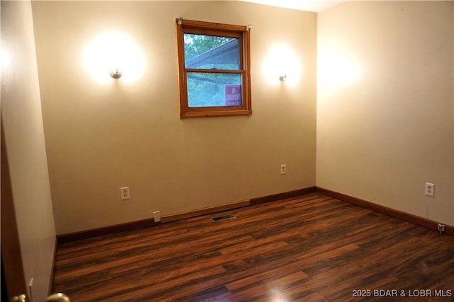 747 Paulson Dr, Edwards, MO 65326 - unfurnished room featuring dark hardwood / wood-style flooring