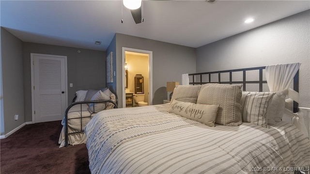 carpeted bedroom with connected bathroom and ceiling fan