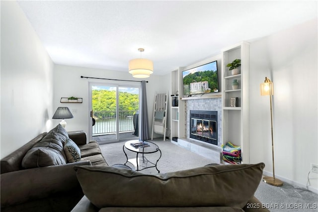 living room with a fireplace and carpet flooring