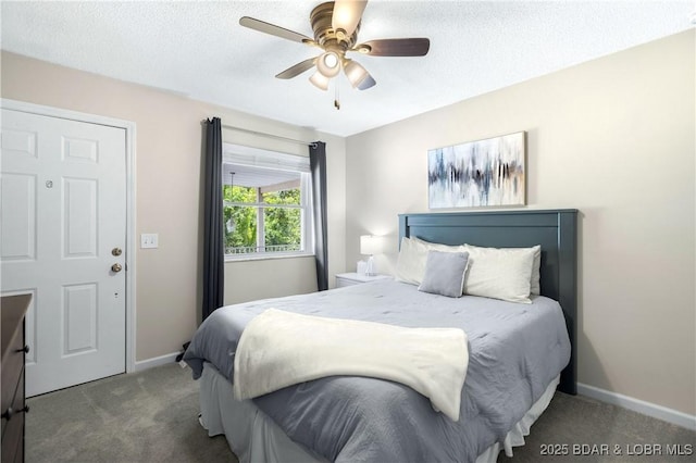 bedroom featuring ceiling fan, carpet floors, and a textured ceiling