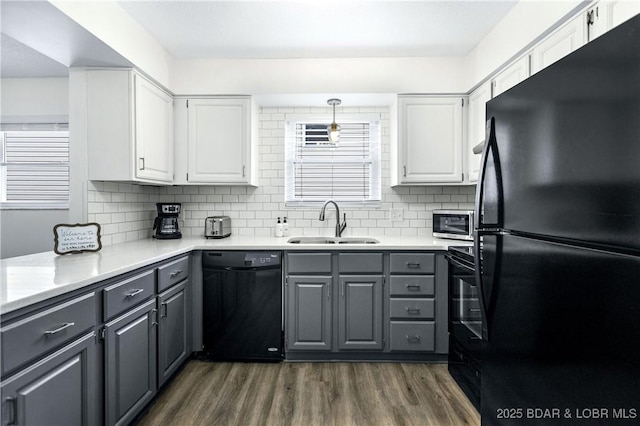 kitchen featuring gray cabinets, sink, white cabinets, and black appliances