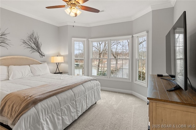 bedroom with light carpet, crown molding, and ceiling fan