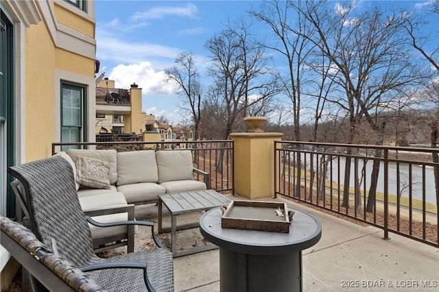 view of patio featuring a balcony and outdoor lounge area