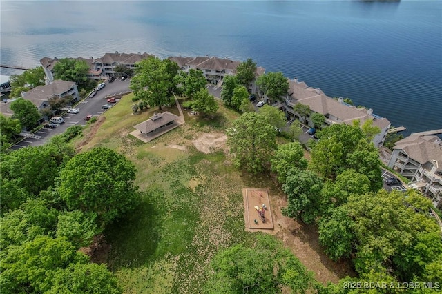 birds eye view of property with a water view