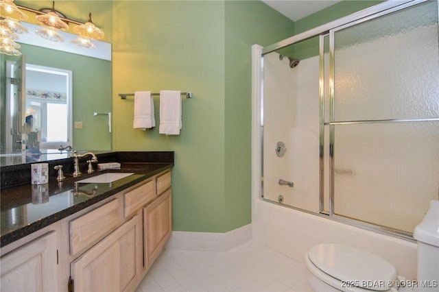 full bathroom with enclosed tub / shower combo, vanity, toilet, and tile patterned flooring