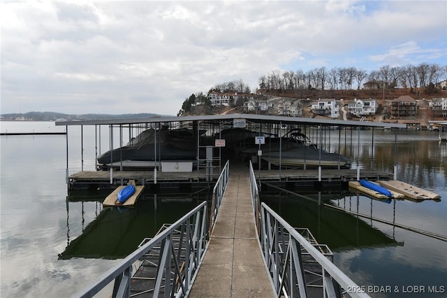 dock area featuring a water view