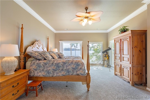 carpeted bedroom with crown molding and ceiling fan