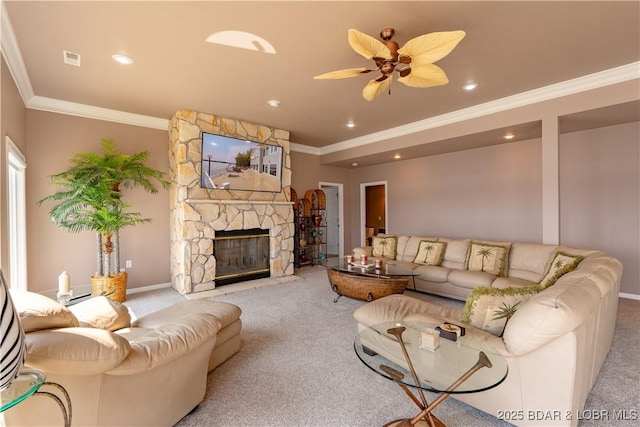 living room featuring ornamental molding, a stone fireplace, light colored carpet, and ceiling fan