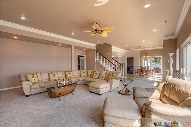 living room with crown molding, ceiling fan with notable chandelier, and light carpet