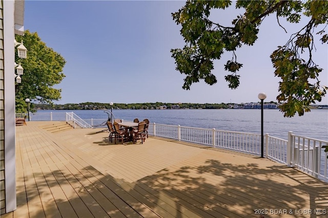 wooden deck featuring a water view