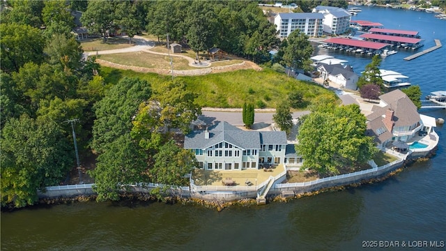 birds eye view of property with a water view