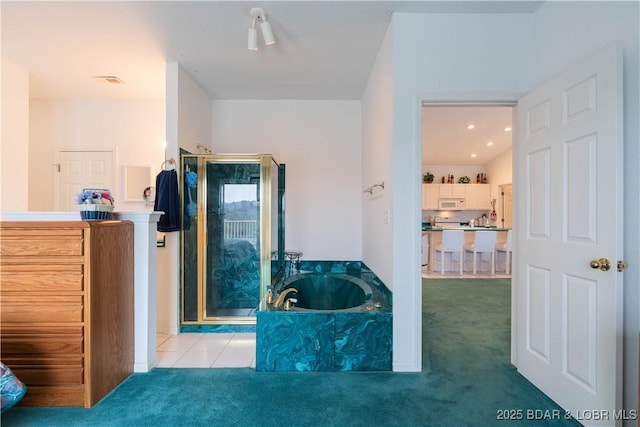 bathroom featuring separate shower and tub and tile patterned floors