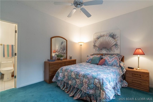 bedroom with ceiling fan, ensuite bathroom, and carpet