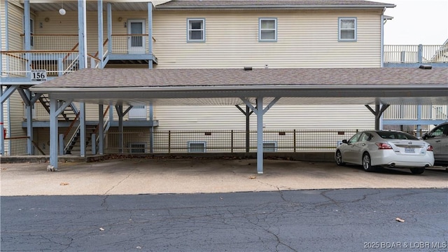 view of parking / parking lot with a carport