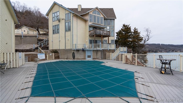 view of pool with a wooden deck