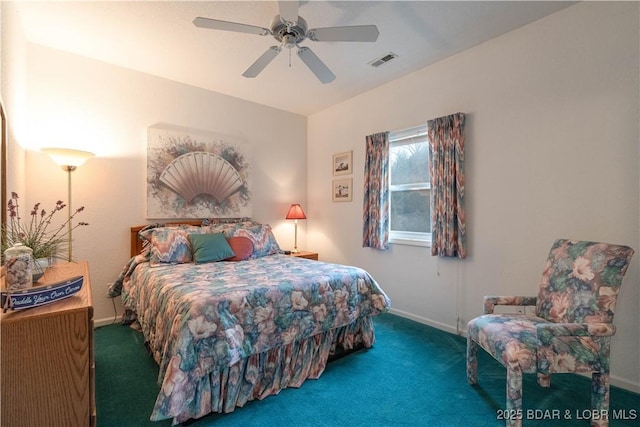 bedroom featuring ceiling fan and dark carpet