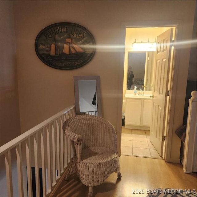 interior space with sink and light hardwood / wood-style flooring