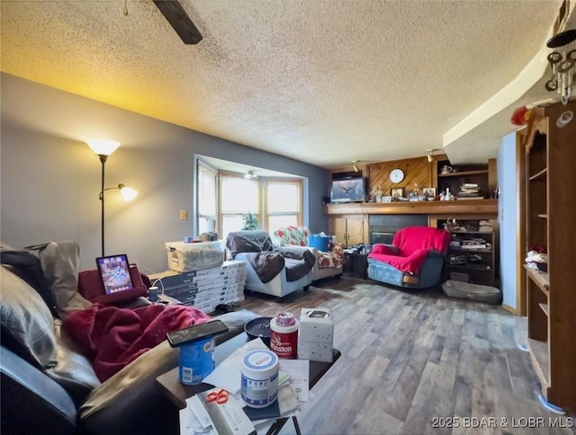 living room featuring hardwood / wood-style flooring and a textured ceiling