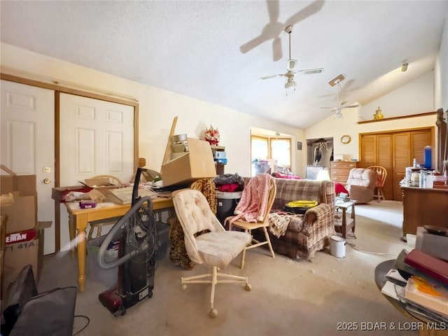 interior space featuring vaulted ceiling, carpet floors, and ceiling fan