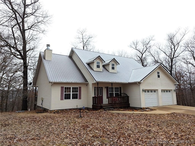 new england style home with a garage