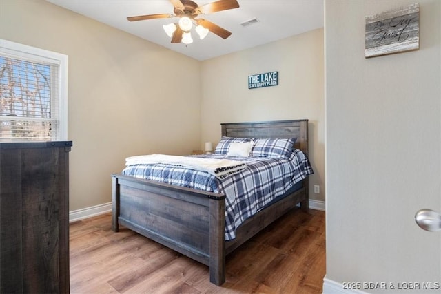 bedroom featuring wood-type flooring and ceiling fan