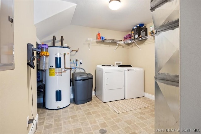 laundry room with water heater and independent washer and dryer