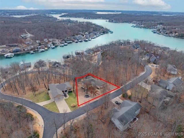 birds eye view of property with a water view