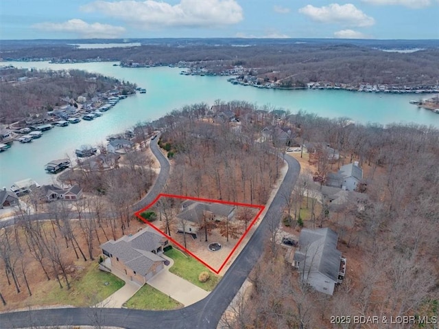 birds eye view of property featuring a water view